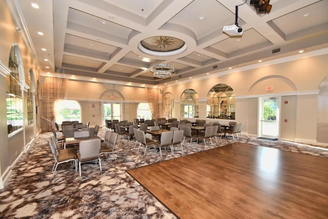 12388 Lakeridge Falls Dr, Boynton Beach, FL 33437 - dining room with coffered ceiling, a towering ceiling, beamed ceiling, recessed lighting, and crown molding