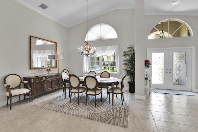 12388 Lakeridge Falls Dr, Boynton Beach, FL 33437 - dining room featuring healthy amount of natural light, a chandelier, high vaulted ceiling, french doors, and crown molding
