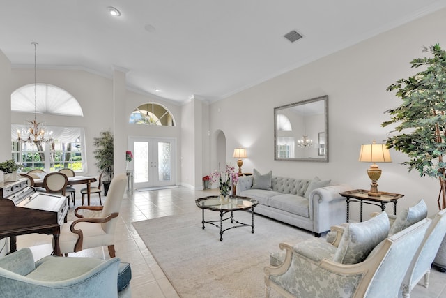 12388 Lakeridge Falls Dr, Boynton Beach, FL 33437 - tiled living room featuring a chandelier, vaulted ceiling, arched walkways, crown molding, and french doors