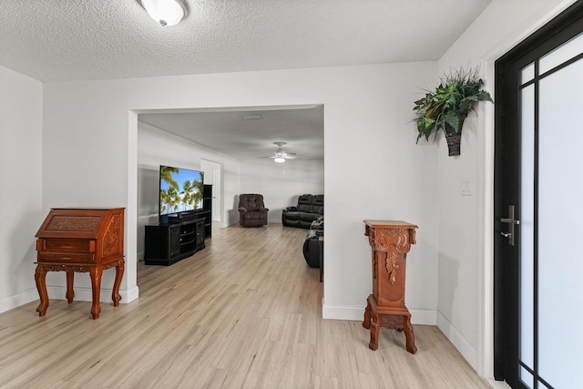 1144 NW 12th Ter, Stuart, FL 34994 - entryway featuring light wood finished floors and ceiling fan