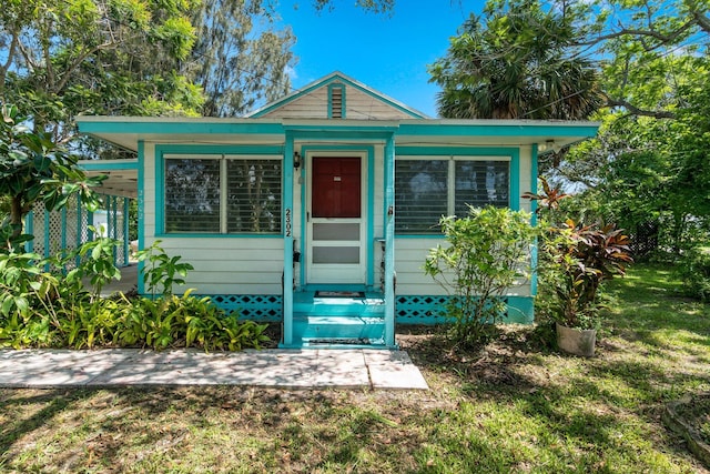 2302 Cortez Blvd, Fort Pierce, FL 34982 - view of front facade featuring a front lawn and entry steps