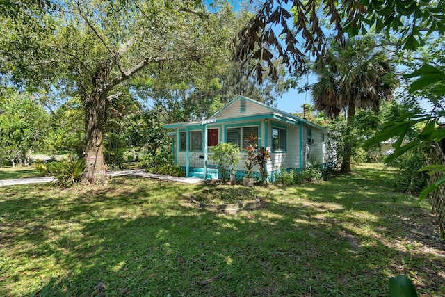 2302 Cortez Blvd, Fort Pierce, FL 34982 - view of front facade featuring a front lawn