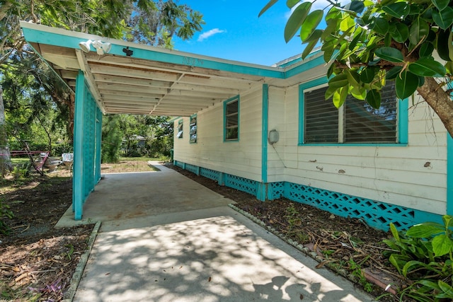2302 Cortez Blvd, Fort Pierce, FL 34982 - view of patio / terrace with a carport and concrete driveway