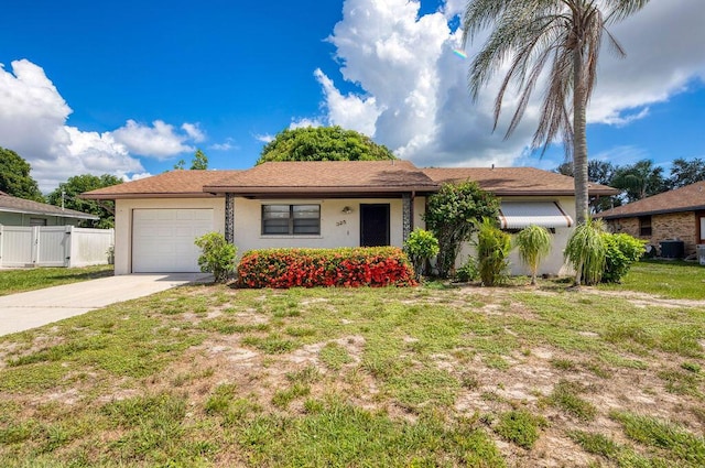 325 SE Bayview Ter, Port Saint Lucie, FL 34983 - ranch-style house featuring a garage, concrete driveway, and stucco siding