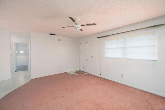 325 SE Bayview Ter, Port Saint Lucie, FL 34983 - carpeted spare room featuring ceiling fan and a textured ceiling