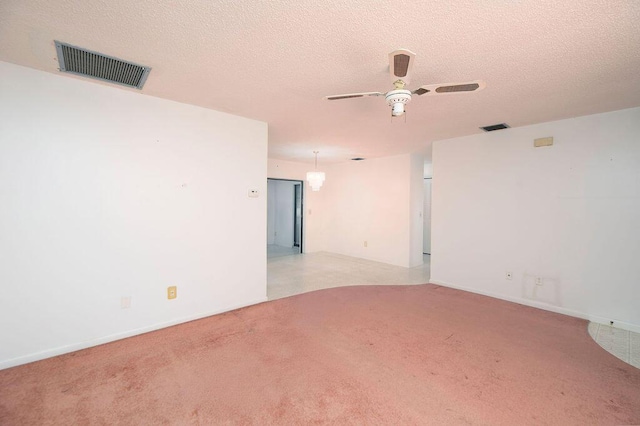 325 SE Bayview Ter, Port Saint Lucie, FL 34983 - spare room with ceiling fan, light colored carpet, and a textured ceiling