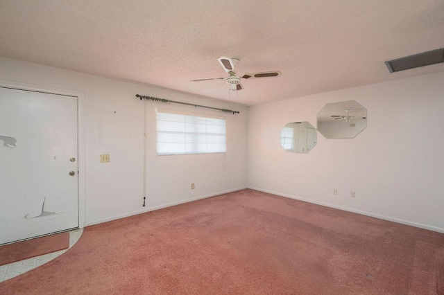 325 SE Bayview Ter, Port Saint Lucie, FL 34983 - carpeted spare room featuring a textured ceiling and ceiling fan