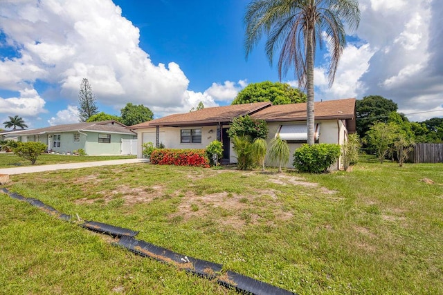 325 SE Bayview Ter, Port Saint Lucie, FL 34983 - single story home with an attached garage, driveway, and stucco siding