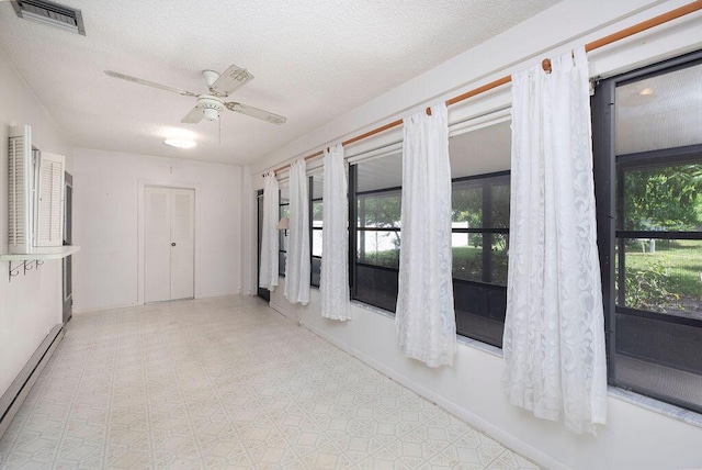 325 SE Bayview Ter, Port Saint Lucie, FL 34983 - unfurnished sunroom featuring a baseboard radiator and french doors