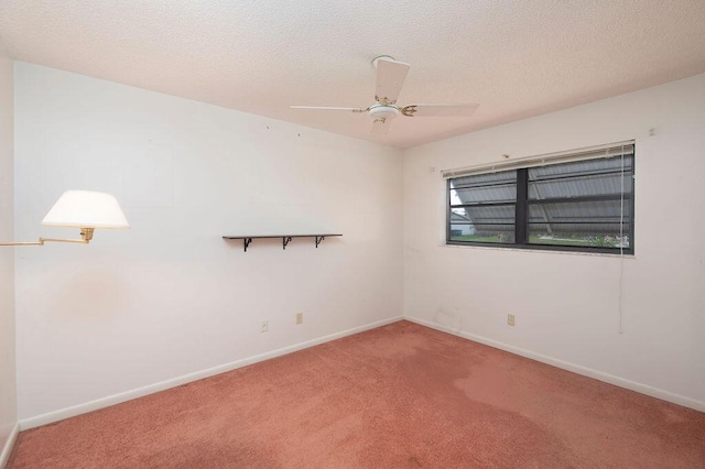 325 SE Bayview Ter, Port Saint Lucie, FL 34983 - carpeted empty room with a textured ceiling and ceiling fan