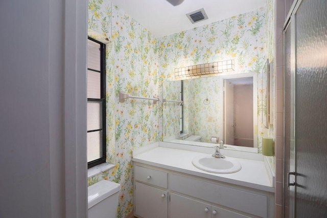 325 SE Bayview Ter, Port Saint Lucie, FL 34983 - bathroom featuring wallpapered walls and vanity