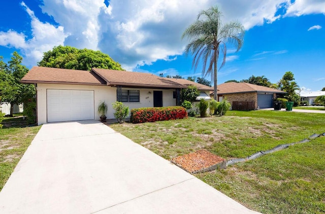 325 SE Bayview Ter, Port Saint Lucie, FL 34983 - ranch-style house featuring an attached garage, driveway, a front lawn, and stucco siding