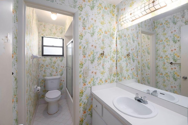 325 SE Bayview Ter, Port Saint Lucie, FL 34983 - full bath with vanity, tile patterned floors, and combined bath / shower with glass door