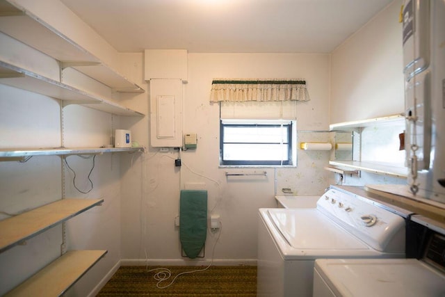 325 SE Bayview Ter, Port Saint Lucie, FL 34983 - washroom with electric panel, washing machine and clothes dryer, and carpet flooring