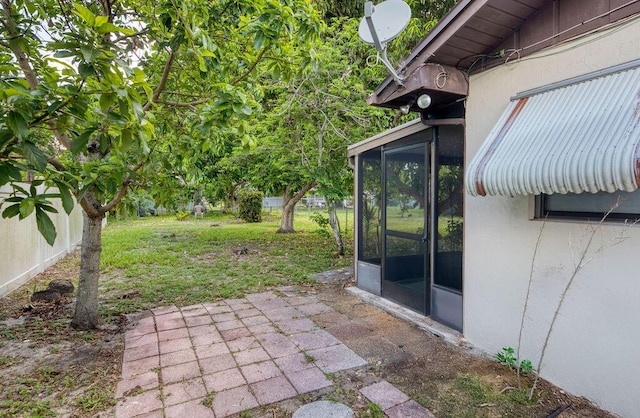 325 SE Bayview Ter, Port Saint Lucie, FL 34983 - view of yard with a sunroom and a patio area