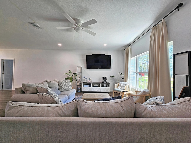 690 NE 150th Ct, Morriston, FL 32668 - living area featuring wood finished floors, ceiling fan, a textured ceiling, and recessed lighting