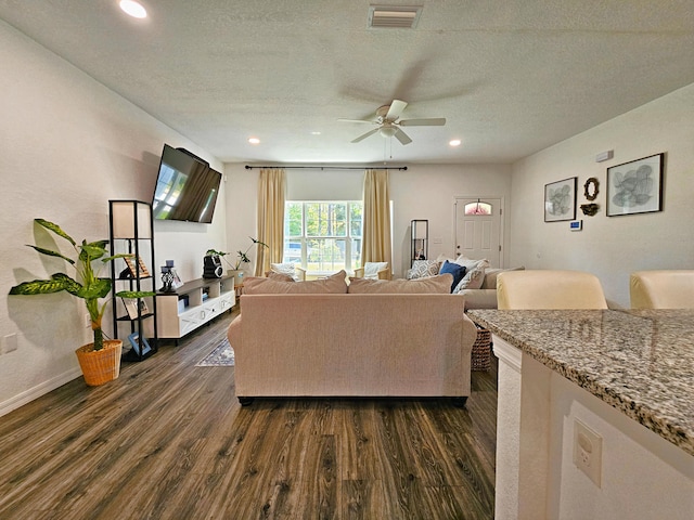 690 NE 150th Ct, Morriston, FL 32668 - living room with dark wood-style floors, a ceiling fan, recessed lighting, and a textured ceiling