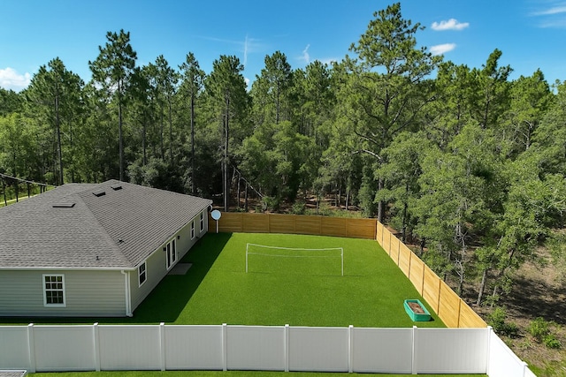 690 NE 150th Ct, Morriston, FL 32668 - view of tennis court featuring an area for soccer, a fenced backyard, and a view of trees