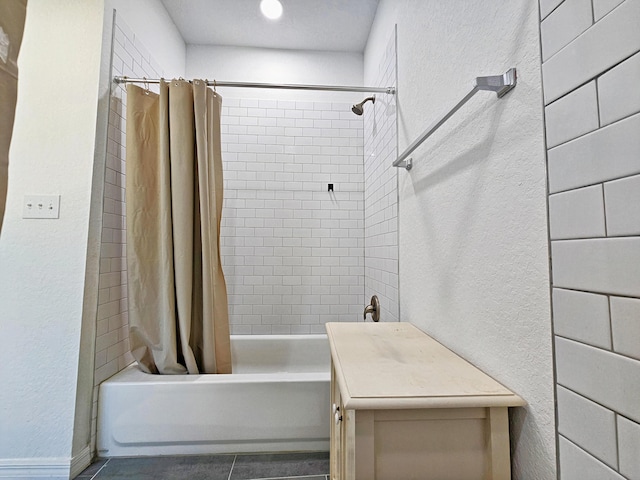 690 NE 150th Ct, Morriston, FL 32668 - full bathroom featuring shower / bath combo, tile patterned flooring, and a textured wall