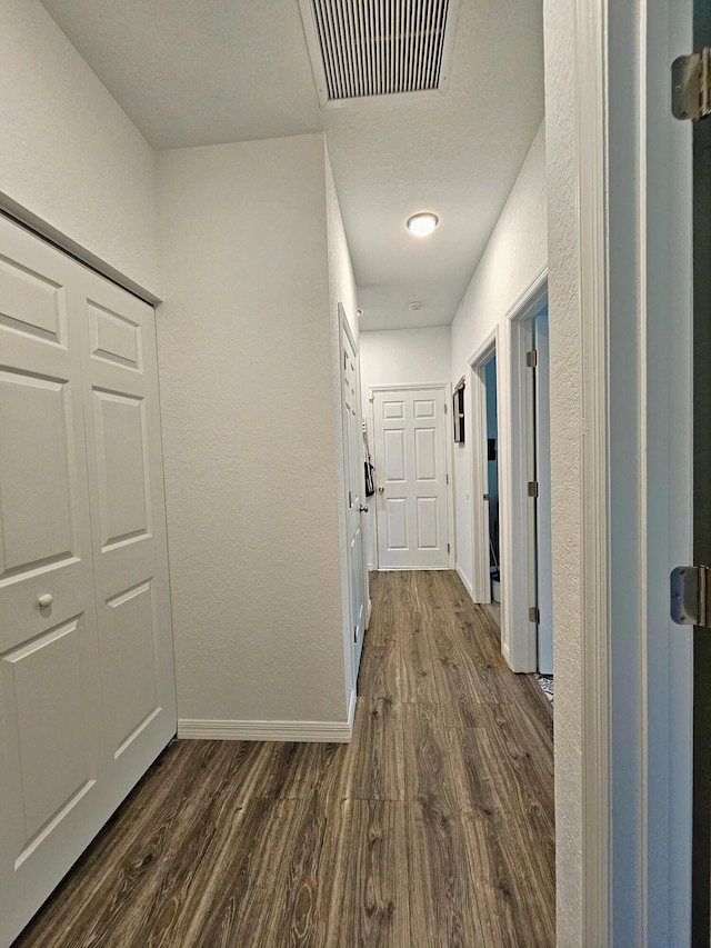690 NE 150th Ct, Morriston, FL 32668 - hallway with dark wood-style floors