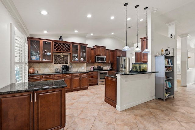 468 SW Prado Ave, Port Saint Lucie, FL 34983 - kitchen with appliances with stainless steel finishes, decorative backsplash, a peninsula, lofted ceiling, and crown molding