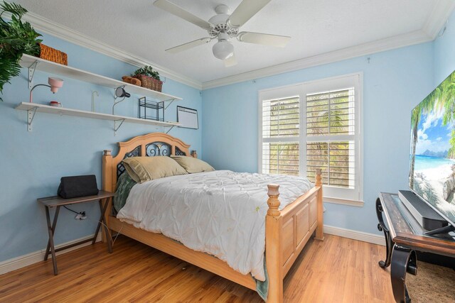 468 SW Prado Ave, Port Saint Lucie, FL 34983 - bedroom with crown molding, light wood-style flooring, and ceiling fan