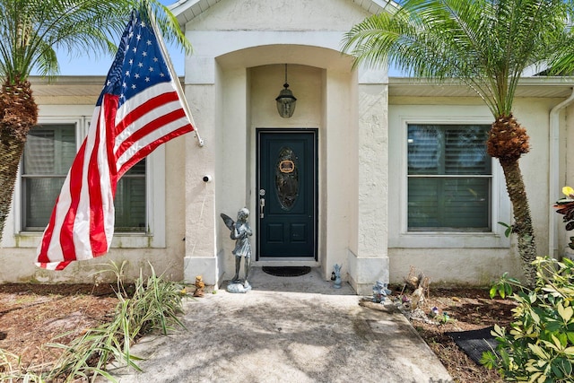 468 SW Prado Ave, Port Saint Lucie, FL 34983 - doorway to property featuring stucco siding