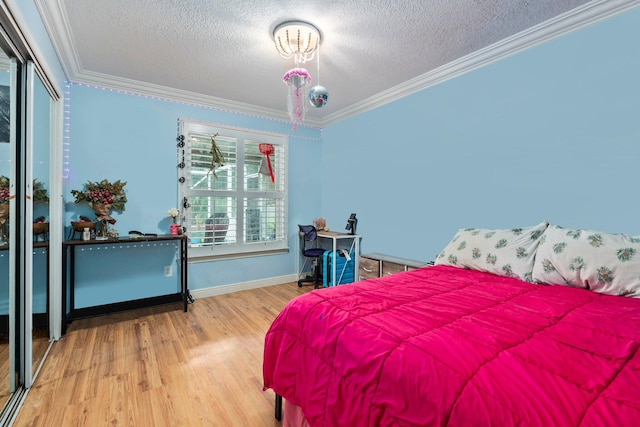 468 SW Prado Ave, Port Saint Lucie, FL 34983 - bedroom featuring ornamental molding, a textured ceiling, wood finished floors, and a closet