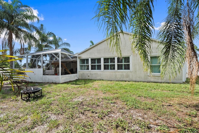 468 SW Prado Ave, Port Saint Lucie, FL 34983 - back of property featuring stucco siding, a lanai, and a lawn