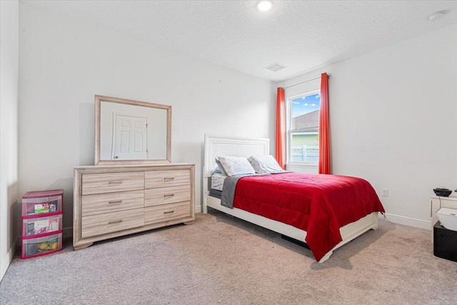5371 NW Almond Ave, Port Saint Lucie, FL 34986 - bedroom with a textured ceiling and carpet flooring
