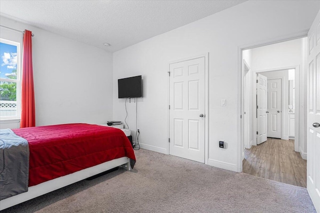 5371 NW Almond Ave, Port Saint Lucie, FL 34986 - bedroom featuring carpet floors and a textured ceiling