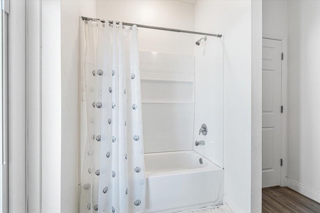 5371 NW Almond Ave, Port Saint Lucie, FL 34986 - bathroom featuring shower / bathtub combination with curtain and wood finished floors