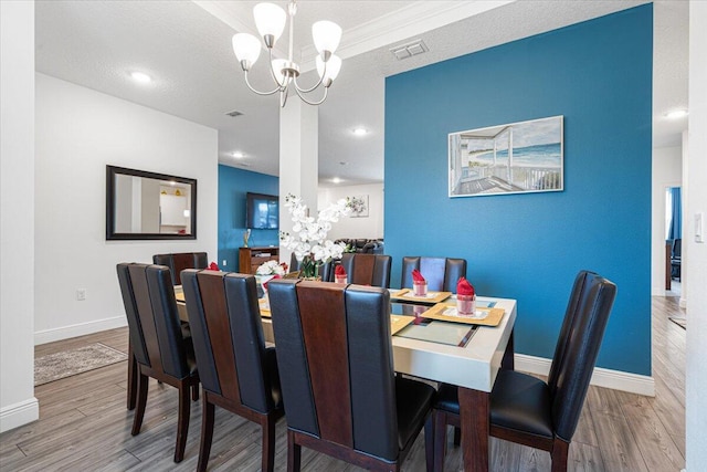 5371 NW Almond Ave, Port Saint Lucie, FL 34986 - dining area with a chandelier, wood finished floors, and recessed lighting