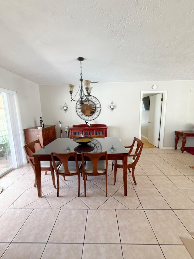 637 SW Sail Ter, Port Saint Lucie, FL 34953 - dining room with a chandelier, light tile patterned floors, and a textured ceiling