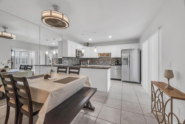 2004 SE Round Table Dr Unit 0, Port Saint Lucie, FL 34952 - dining area with light tile patterned floors and recessed lighting