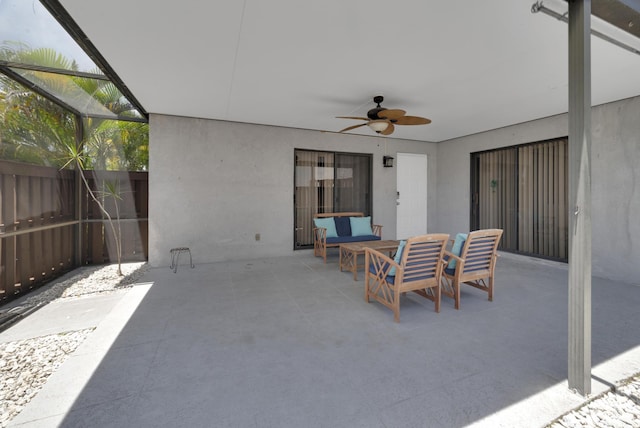 2004 SE Round Table Dr Unit 0, Port Saint Lucie, FL 34952 - view of patio featuring a ceiling fan, glass enclosure, and outdoor dining area