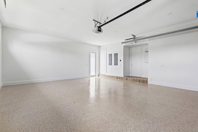 471 NW 9th St, Boca Raton, FL 33432 - garage featuring a garage door opener and electric panel
