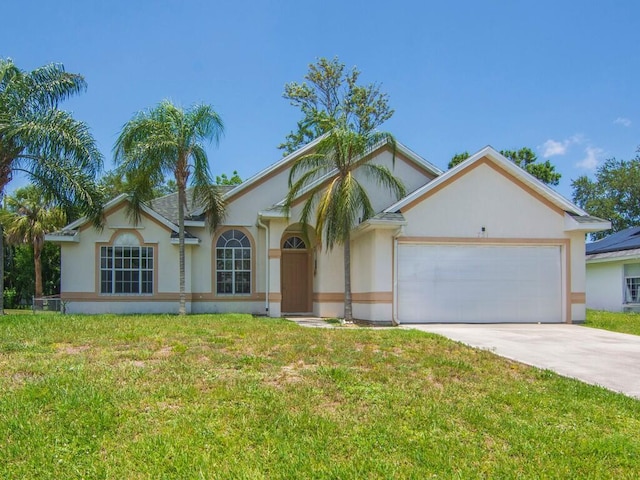 751 SE Majestic Ter, Port Saint Lucie, FL 34953 - ranch-style home with a garage, concrete driveway, stucco siding, and a front yard