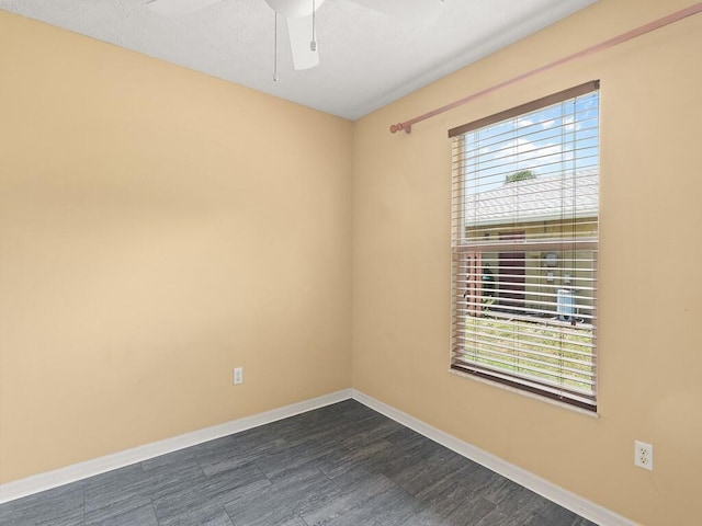 751 SE Majestic Ter, Port Saint Lucie, FL 34953 - empty room featuring healthy amount of natural light, a ceiling fan, and dark wood-style flooring