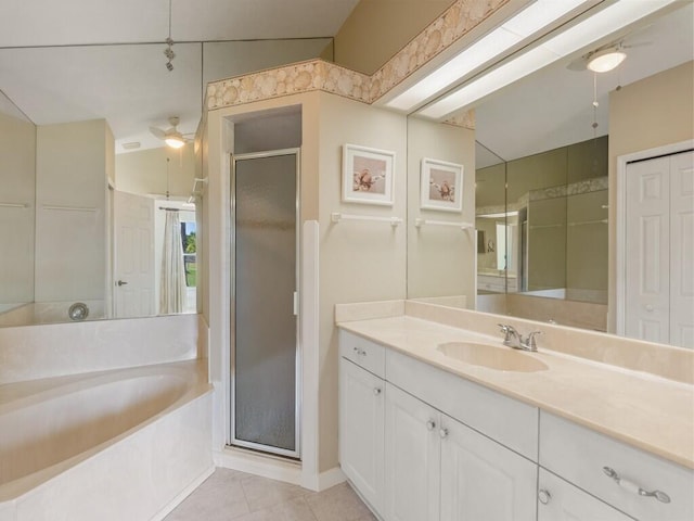 751 SE Majestic Ter, Port Saint Lucie, FL 34953 - bathroom with a shower stall, a bath, vanity, tile patterned floors, and ceiling fan
