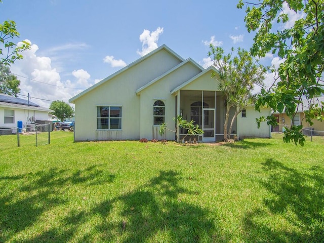 751 SE Majestic Ter, Port Saint Lucie, FL 34953 - back of house featuring a sunroom and stucco siding