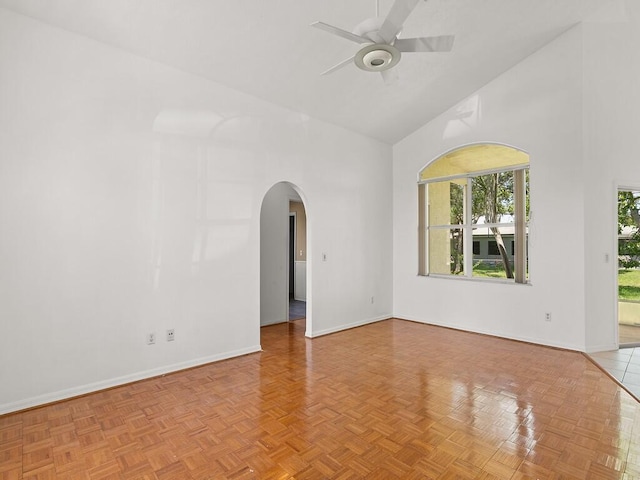 751 SE Majestic Ter, Port Saint Lucie, FL 34953 - spare room featuring arched walkways, high vaulted ceiling, and ceiling fan