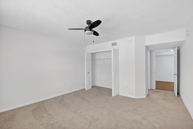 15185 Michelangelo Blvd Unit 207, Delray Beach, FL 33446 - unfurnished bedroom featuring light colored carpet, a closet, ceiling fan, and a textured ceiling