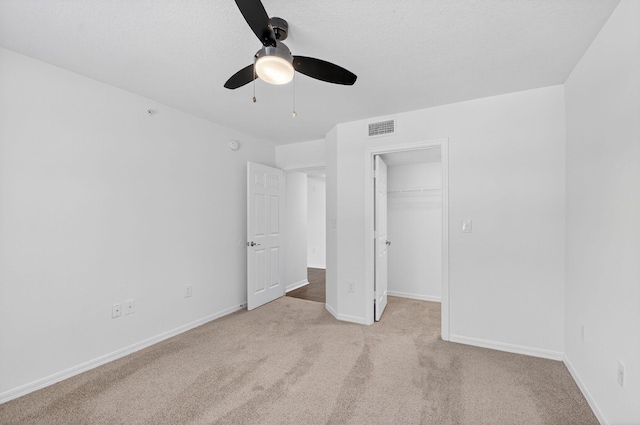 15185 Michelangelo Blvd Unit 207, Delray Beach, FL 33446 - unfurnished bedroom with light carpet, a ceiling fan, a closet, and a spacious closet