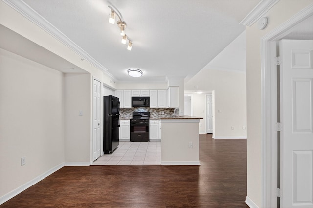 15185 Michelangelo Blvd Unit 207, Delray Beach, FL 33446 - kitchen with black appliances, backsplash, white cabinets, light wood-type flooring, and ornamental molding