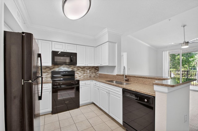 15185 Michelangelo Blvd Unit 207, Delray Beach, FL 33446 - kitchen with black appliances, light tile patterned floors, a peninsula, white cabinets, and crown molding