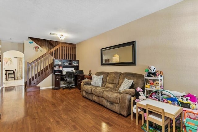 315 Spruce St, Boynton Beach, FL 33426 - living area with arched walkways, wood finished floors, stairway, and a desk