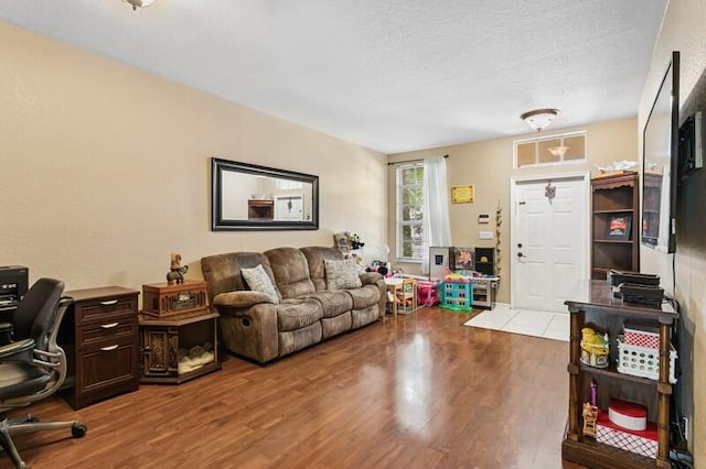 315 Spruce St, Boynton Beach, FL 33426 - living room with wood finished floors, a desk, and a textured ceiling