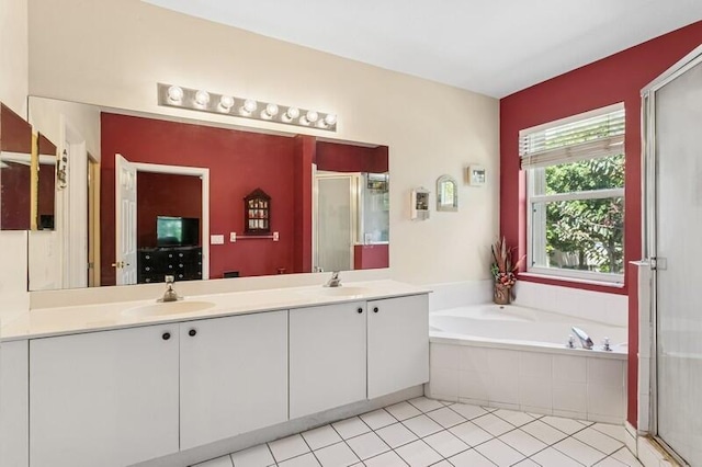 315 Spruce St, Boynton Beach, FL 33426 - full bath featuring a stall shower, double vanity, a garden tub, and tile patterned flooring