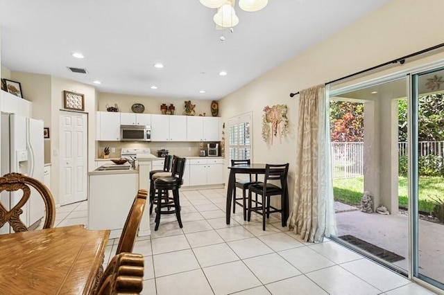 315 Spruce St, Boynton Beach, FL 33426 - dining space featuring plenty of natural light, light tile patterned floors, and recessed lighting